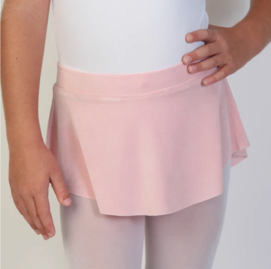 A young ballerina wears a soft, light pink flowy Bullet Pointe ballet skirt.