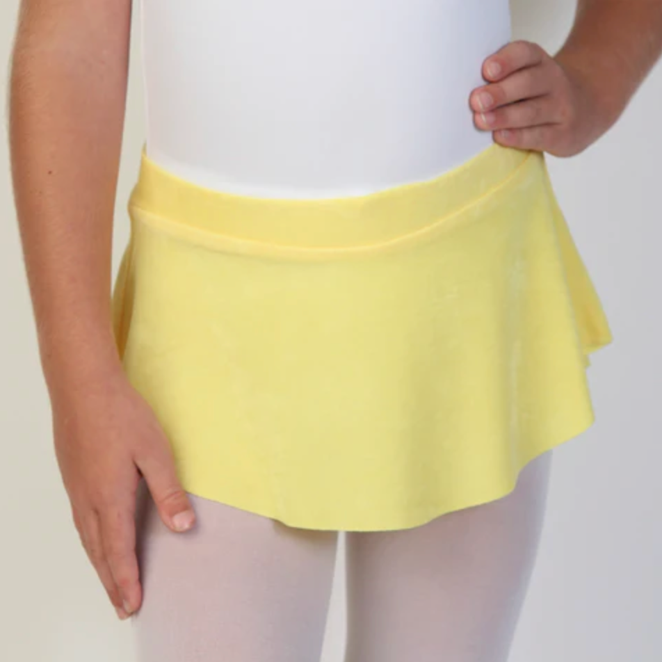 A young ballerina wears a bright yellow flowy Bullet Pointe ballet skirt.