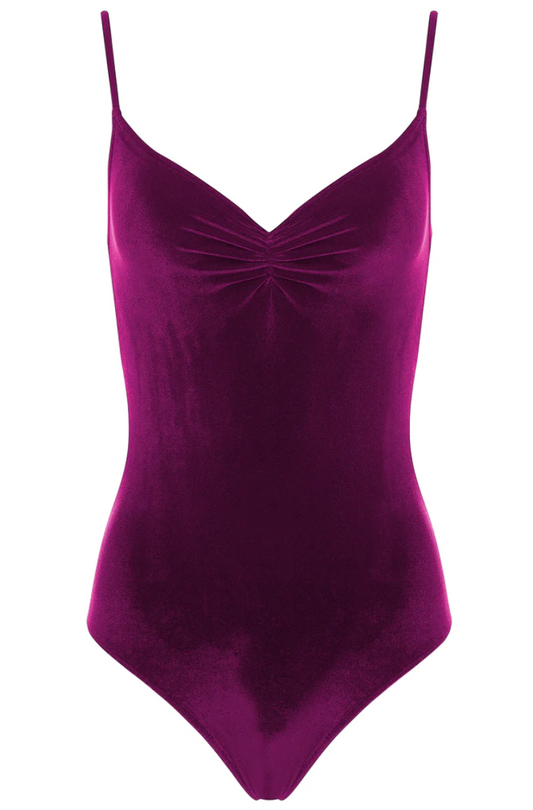 A deep raspberry colored velvet leotard with a v-neck pinch front detail and spaghetti straps.