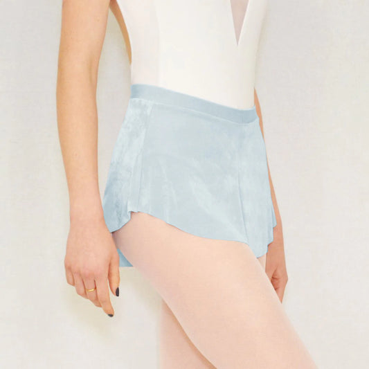 A ballerina wears a light blue flowy Bullet Pointe ballet skirt. 