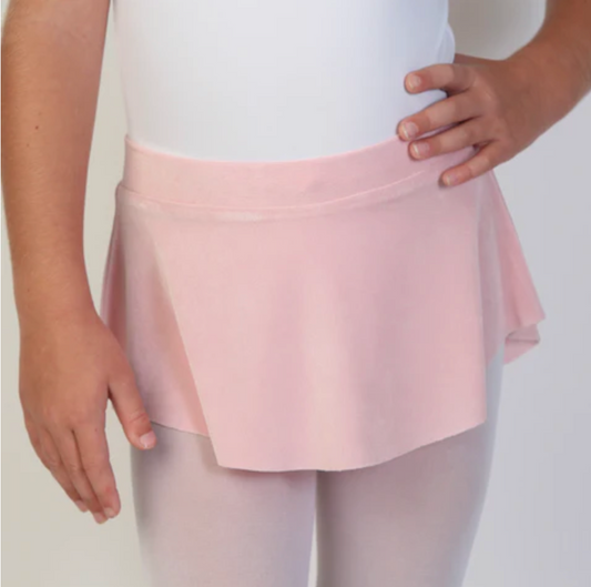 A young ballerina wears a soft, light pink flowy Bullet Pointe ballet skirt. 
