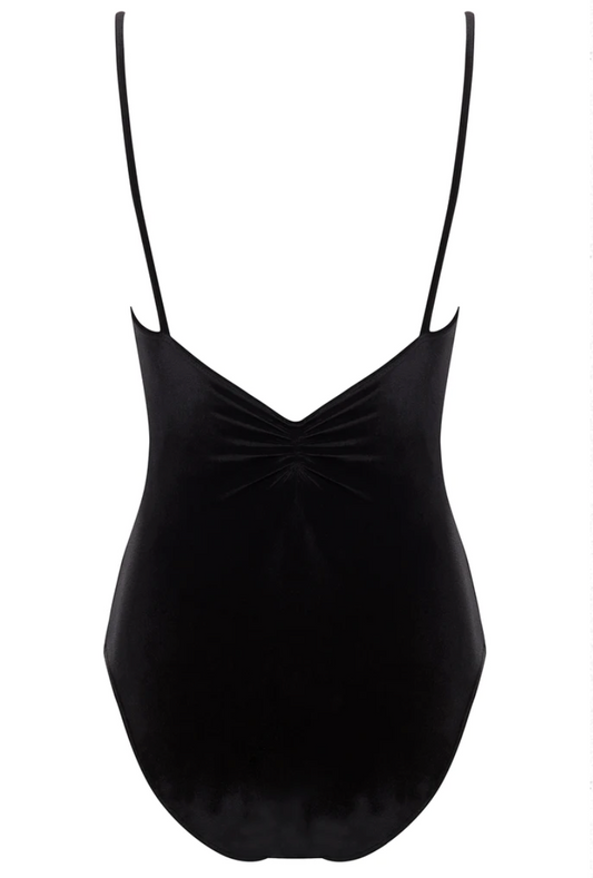 The back of a black leotard, with a pinch detail at the center of the back and spaghetti straps. 