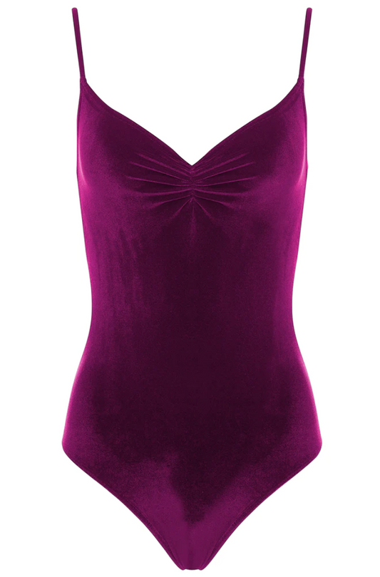 A deep raspberry colored velvet leotard with a v-neck pinch front detail and spaghetti straps. 