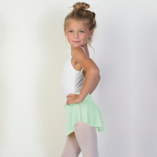 A young ballerina wears a bright seafoam green flowy Bullet Pointe ballet skirt. 