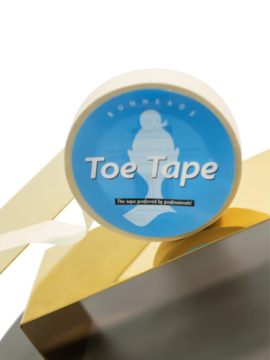 The roll of tape displayed on a gold platform.