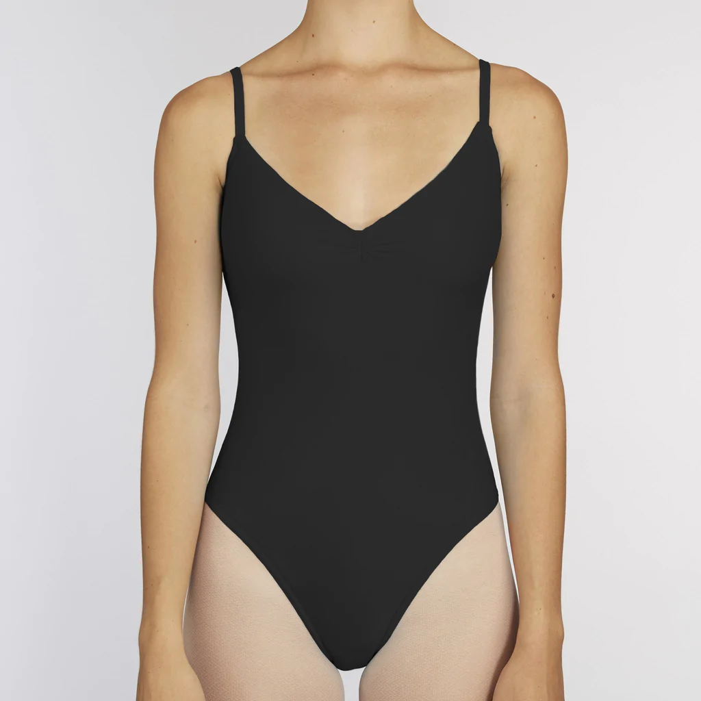 A dancer wears a black simple leotard with a v-neck pinch front neckline and spaghetti straps. 