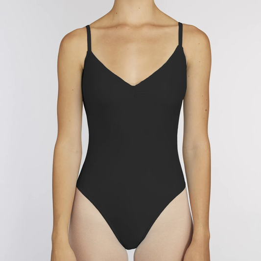 A dancer wears a black simple leotard with a v-neck pinch front neckline and spaghetti straps. 