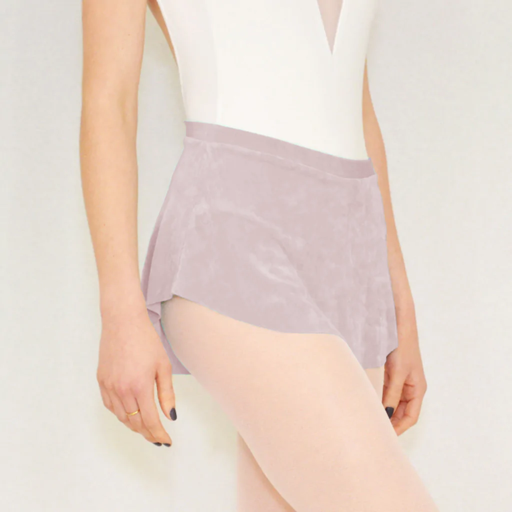 A ballerina wears a pastel purply taupe flowy Bullet Pointe ballet skirt. 
